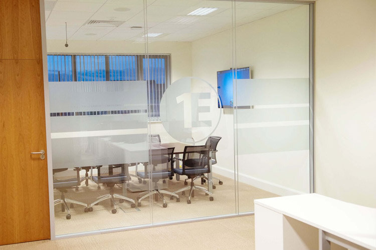 1e boardroom glazed partition with frosted window film 1e logo design