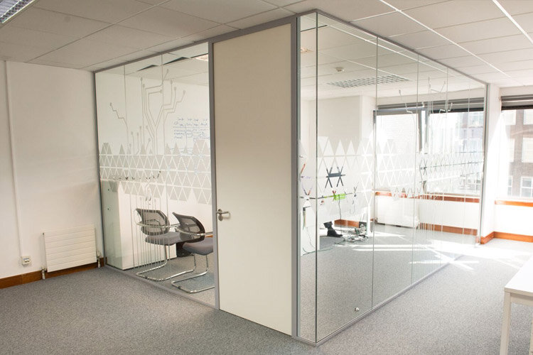 glazed partition wall with sidetrade company graphics